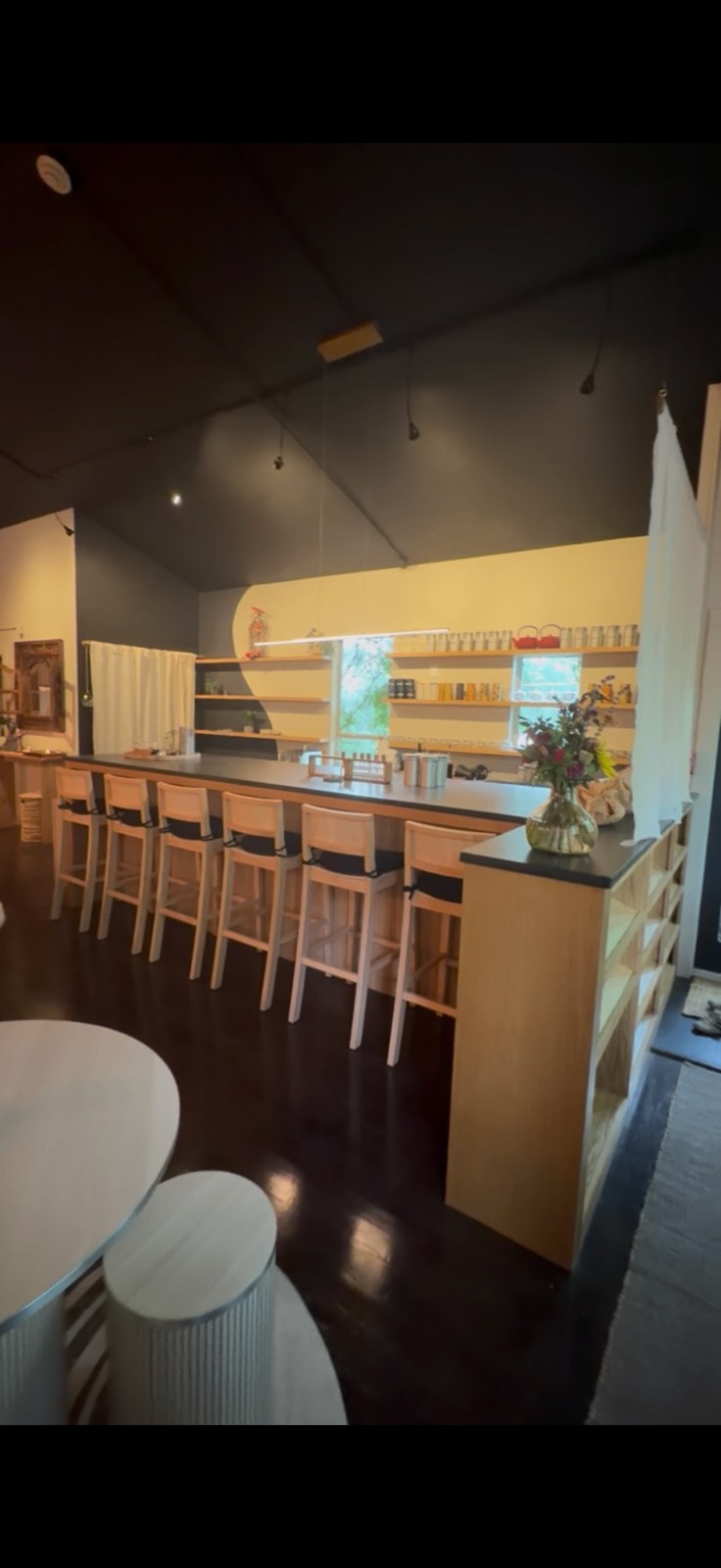 Full view of the ash tea bar and stools